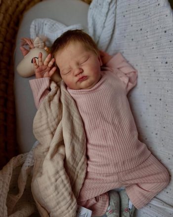 Prototype Quinlyn full body silicone baby doll with brown hair